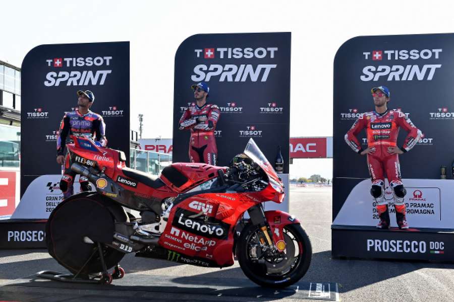 Francesco Bagnaia celebrates on the podium after winning the sprint race 