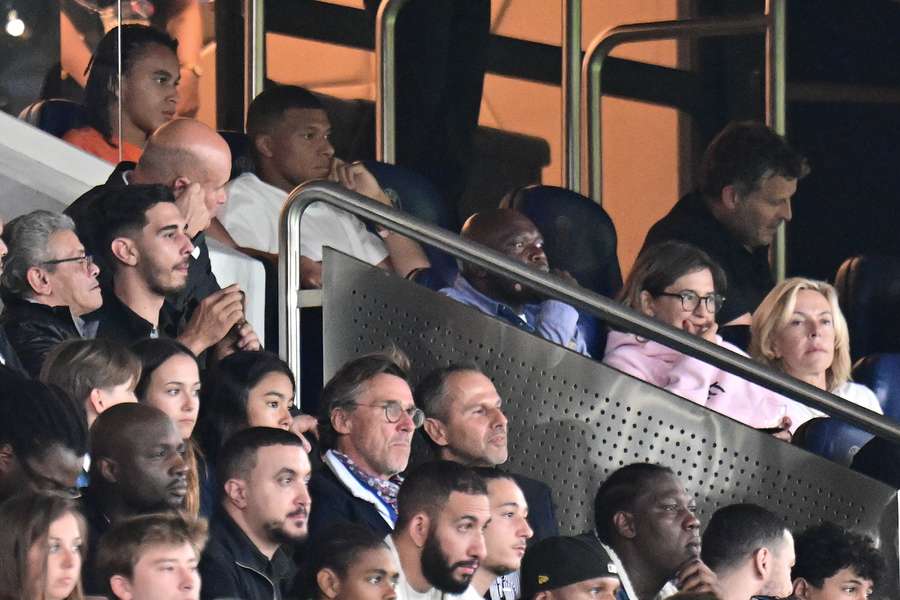 Paris Saint-Germain's French forward Kylian Mbappe attends from the stand for the match between PSG and Lorient