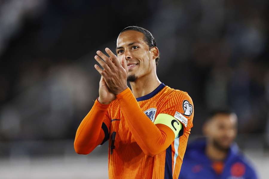 Virgil van Dijk applauds the Dutch fans in Helsinki after the Netherlands' qualifying win over Finland