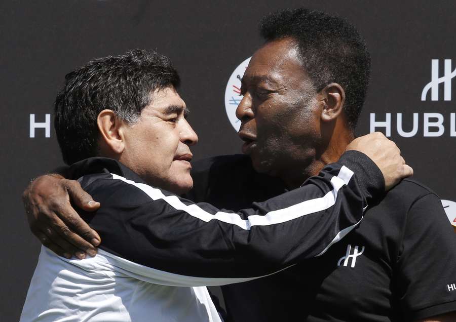 In this file photo taken on June 09, 2016 Diego Maradona Pele pose after a charity football match