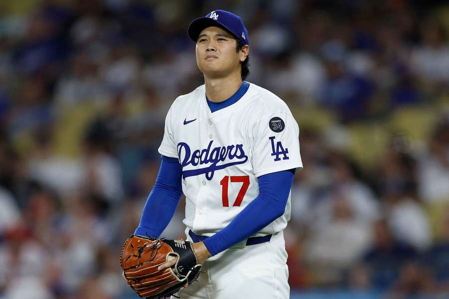 Dodgers' Shohei Ohtani reacts after a pitch