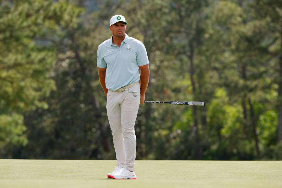 Bryson DeChambeau reacts after a missed putt on the green on the 18th hole during the second round