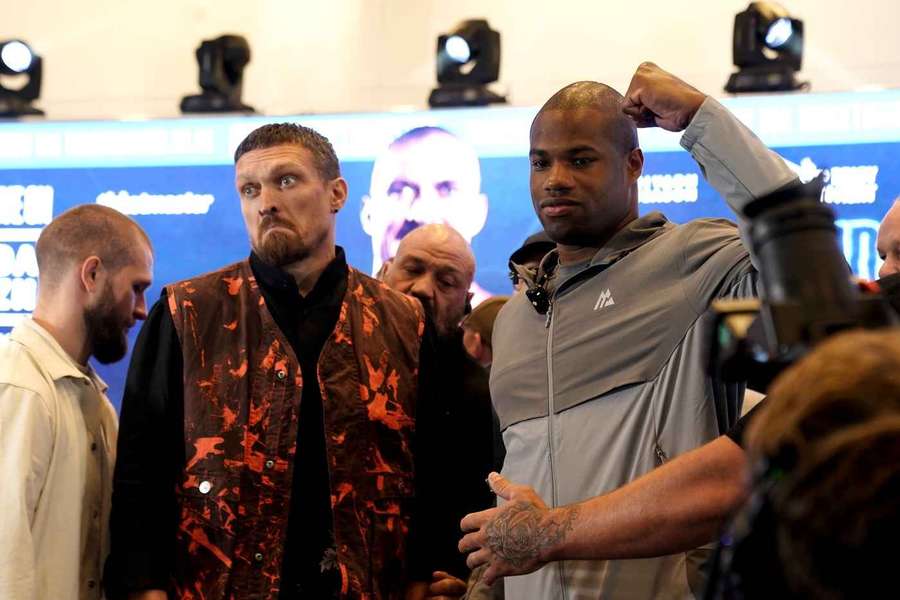 Usyk (L) and Dubois at a press event to promote their fight