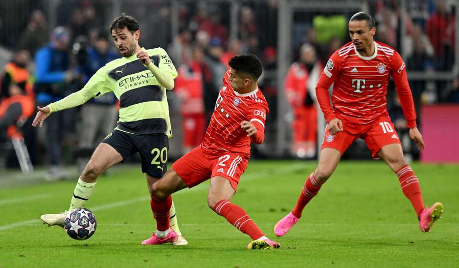 Bernardo Silva vies for the ball with Bayern's Leroy Sane and Joao Cancelo Bernardo Silva vies for the ball with Bayern's Leroy Sane and Joao Cancelo