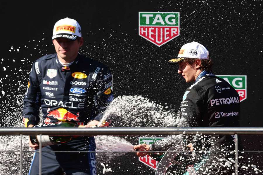 Mercedes' Andrea Kimi Antonelli (right) celebrates on the podium after winning the Spanish Grand Prix alongside second-place Max Verstappen