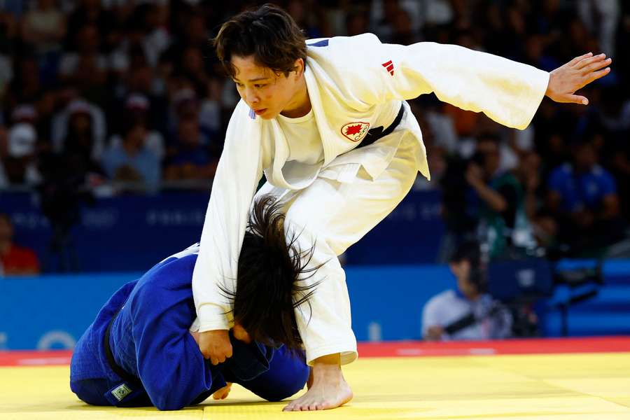 Christa Deguchi van Canada in actie tegen Mimi Huh van Zuid-Korea