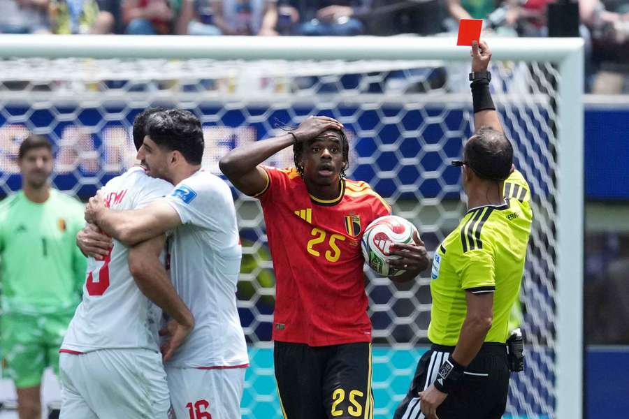 Belgium's Nathan Ngoy is shown a red card by referee Dario Herrera Belgium's Nathan Ngoy is shown a red card by referee Dario Herrera