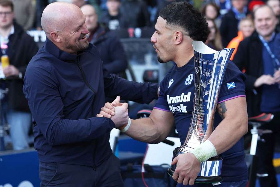 Scotland's Sione Tuipulotu and head coach Gregor Townsend celebrate with the Auld Alliance Trophy