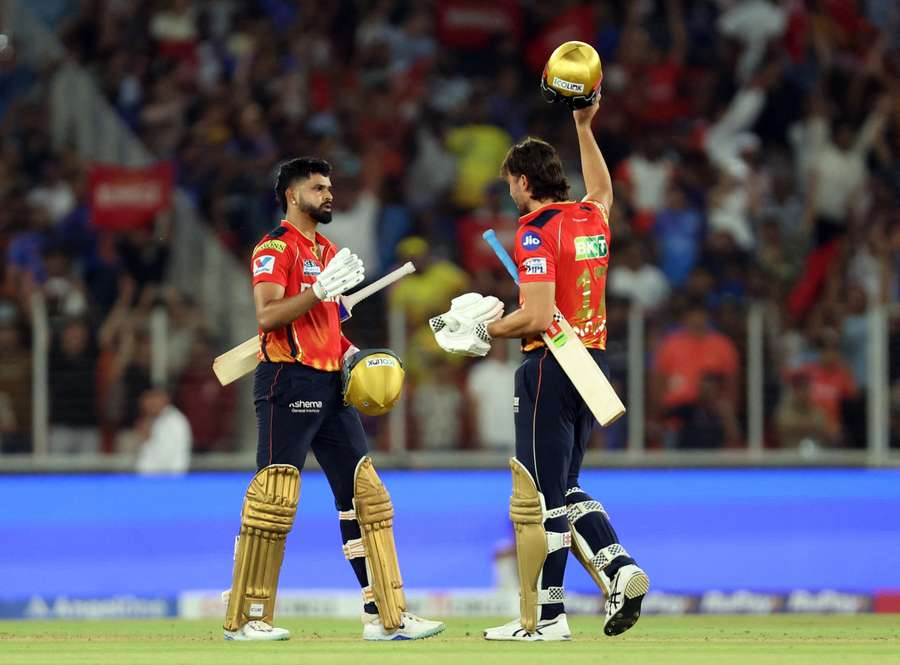 Punjab Kings' Shreyas Iyer and Marcus Stoinis celebrate after beating the Mumbai Indians in the qualifier