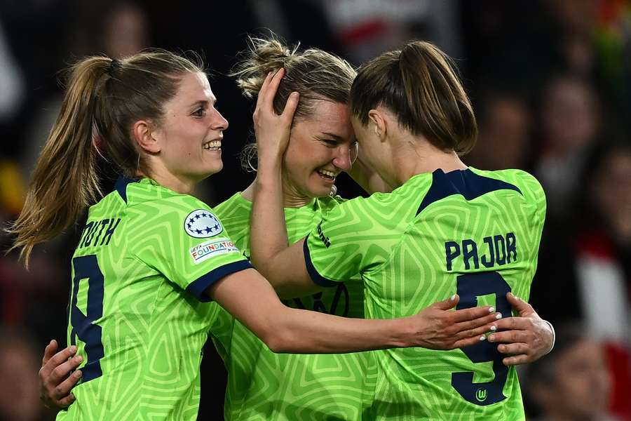 Alexandra Popp celebrates with teammates after Wolfsburg beat Arsenal to book their place in the final