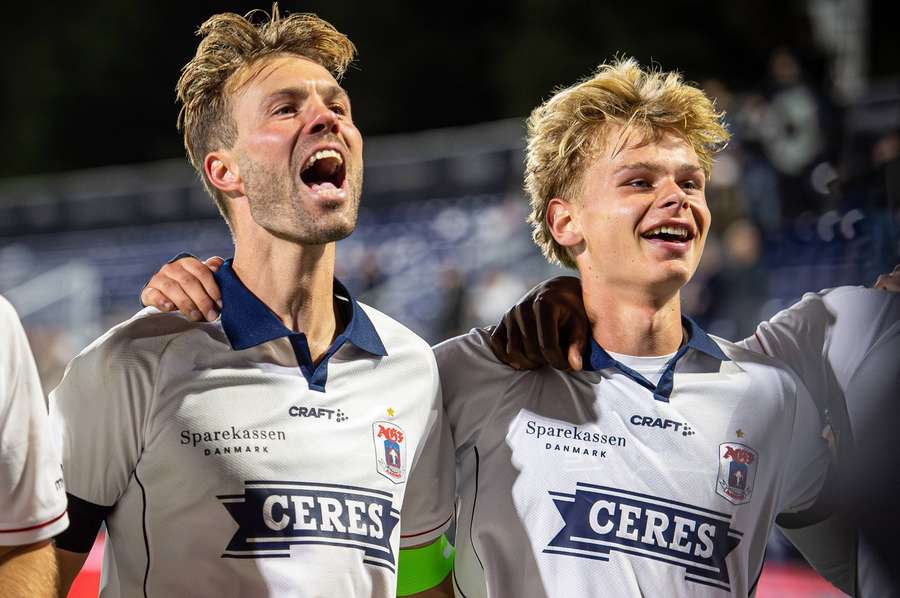 Patrick Mortensen celebrates with Frederik Emmery after the match