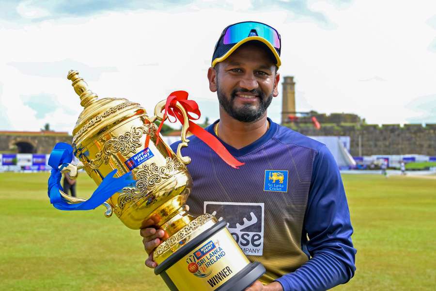 Sri Lanka captain Dimuth Karunaratne poses with the trophy after their series win over Ireland