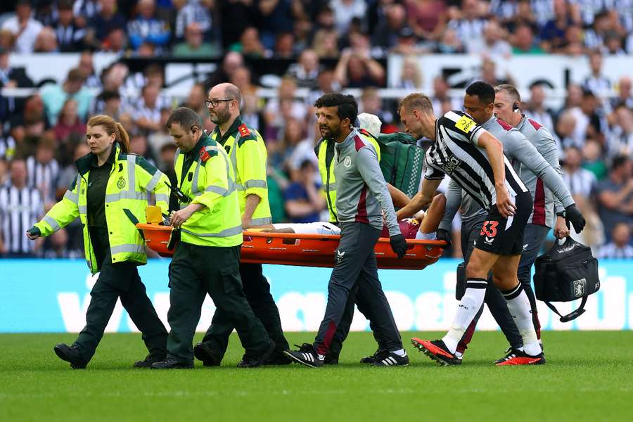 Mings was taken off on a stretcher in the first half against Newcastle