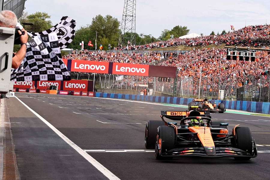 Lando Norris crosses the finish line just ahead of Oscar Piastri at the Hungarian Grand Prix