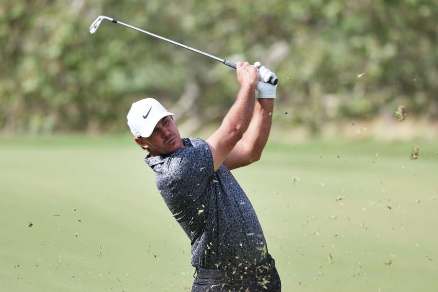 Brooks Koepka of the United States plays a shot on the third hole during a practice round prior to the 123rd US Open Championship