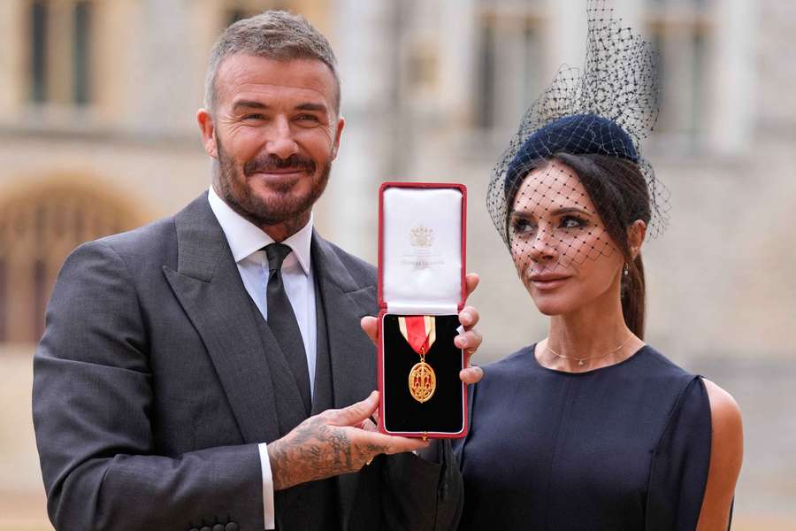 Former England footballer David Beckham (L) poses next to his wife singer and fashion designer Victoria Beckham Former England footballer David Beckham (L) poses next to his wife singer and fashion designer Victoria Beckham