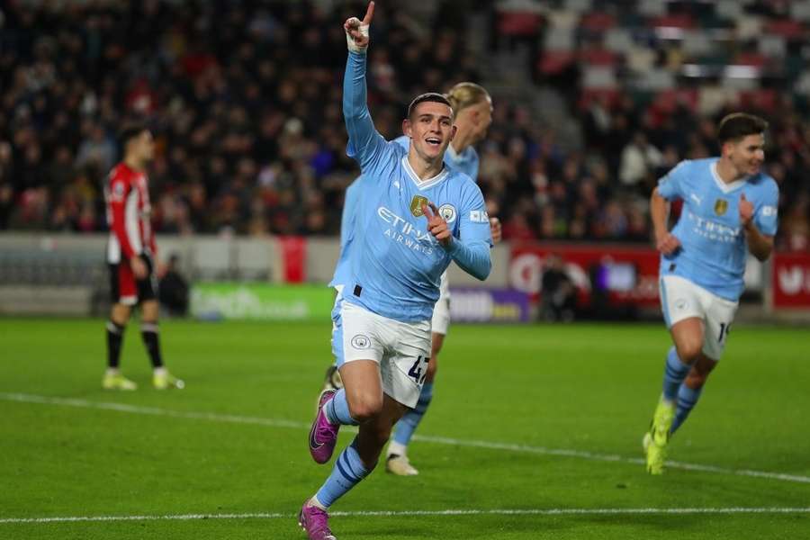 Christian Norgaard celebrates with teammate Keane Lewis-Potter after scoring a late equaliser for Brentford