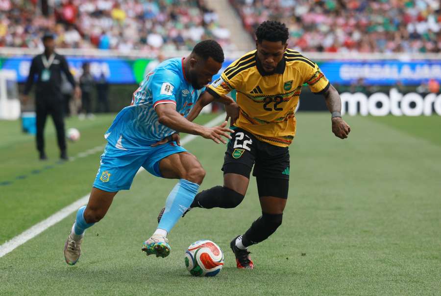 DR Congo's Meschack Elia in action with Jamaica's Ronaldo Webster