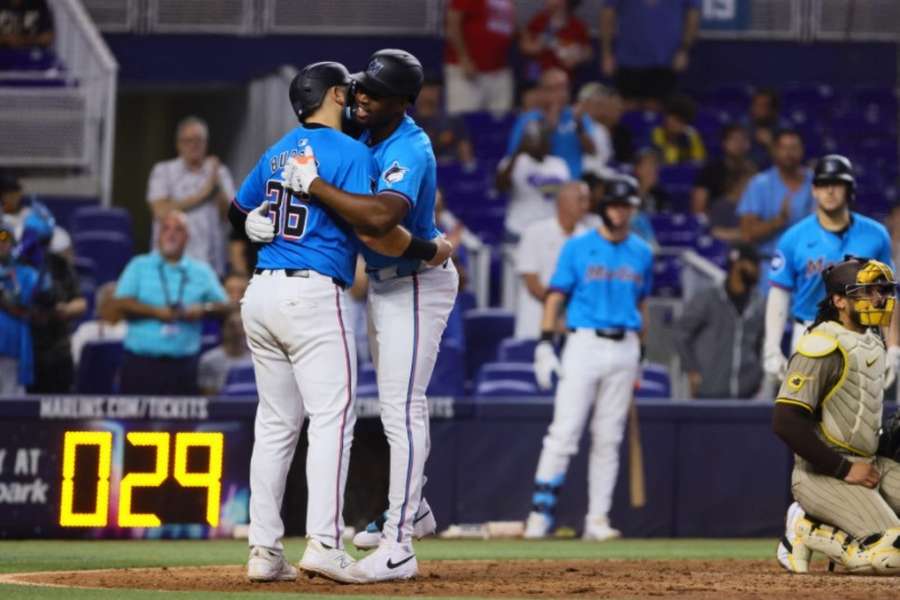 Miami Marlins right fielder Jesus Sanchez celebrates with third baseman Jake Burger after hitting a two-run home run against the San Diego Padres