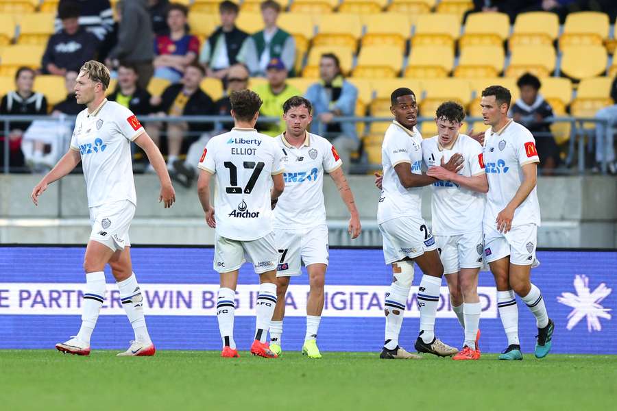 Auckland FC players celebrate a goal in their incredible NZ derby win over Wellington Phoenix.