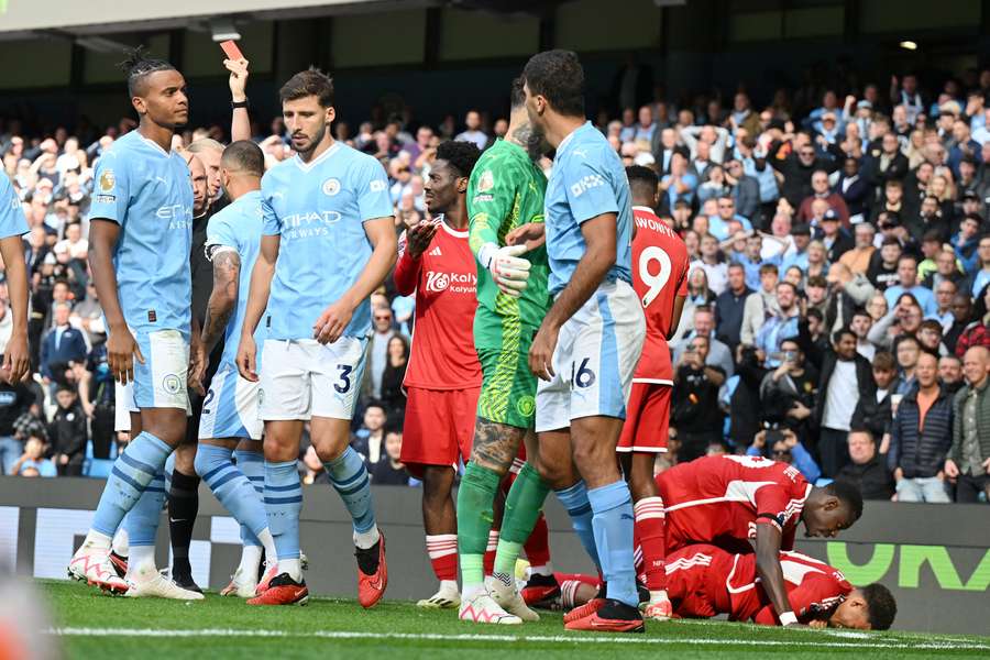 Rodri is given his marching orders by referee Anthony Taylor