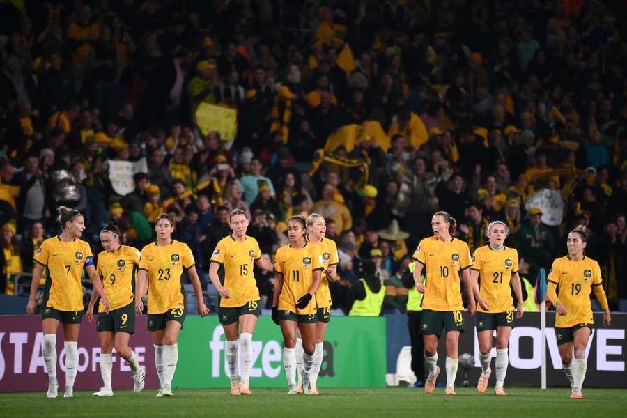 Australia's players celebrate scoring their first goal