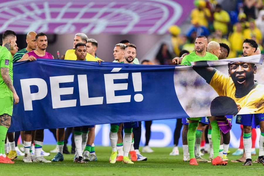 Brazil's players unfurled a banner in tribute to Pele after their last 16 match against South Korea