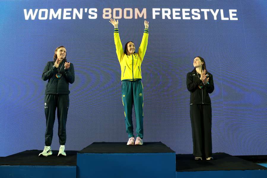 Lani Pallister (middle) celebrates her 800m freestyle victory. Lani Pallister (middle) celebrates her 800m freestyle victory.