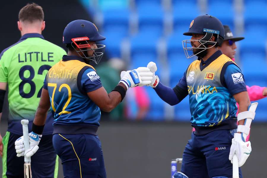 Mendis (R) celebrates Sri Lanka's win with Charith Asalanka