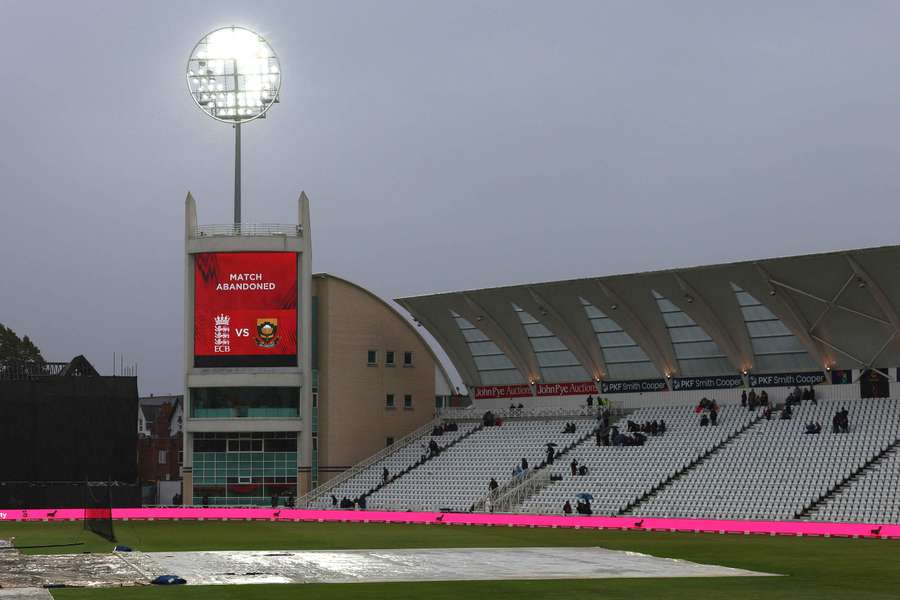The big screen inside the stadium indicates that the match has been abandoned due to rain