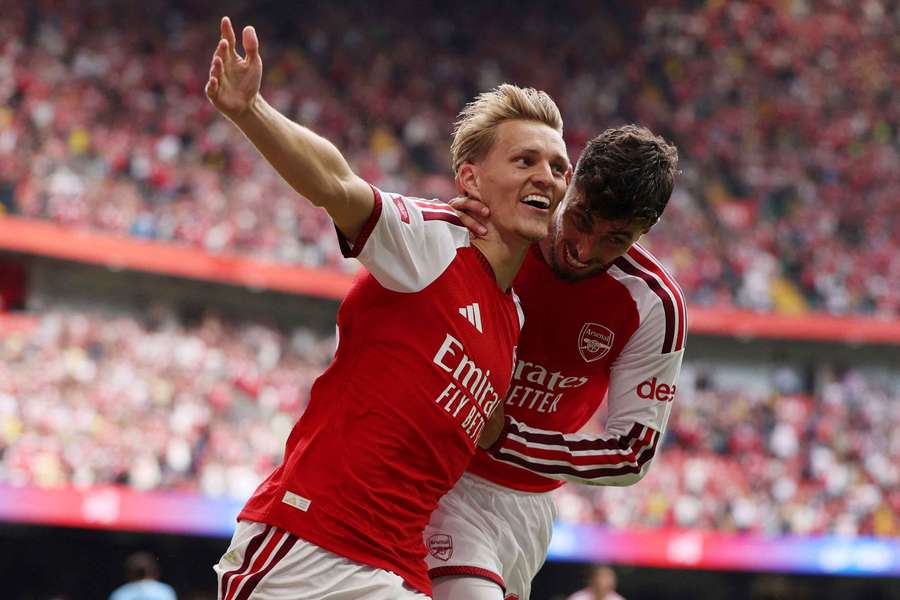 Odegaard (centre) celebrates scoring Arsenal's third goal Odegaard (centre) celebrates scoring Arsenal's third goal