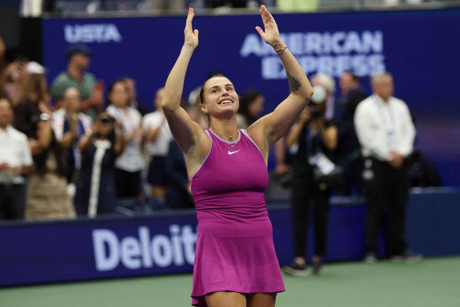 Aryna Sabalenka salutes the crowd after winning the title