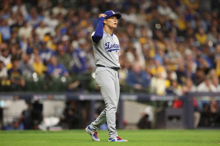 Dodgers Yoshinobu Yamamoto reacts during NLCS Game 2 against the Milwaukee Brewers