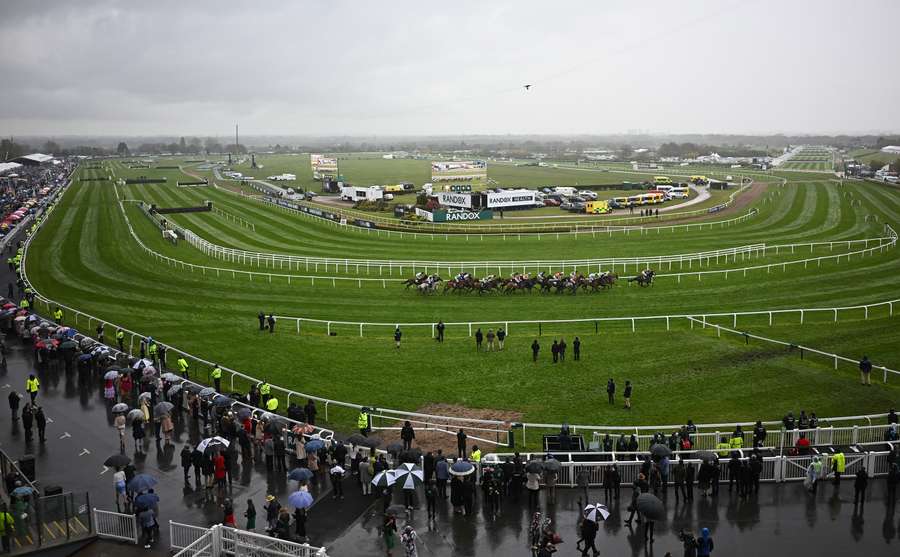 Runners and riders compete in the Handicap Hurdle race on the second day of the Grand National Festival