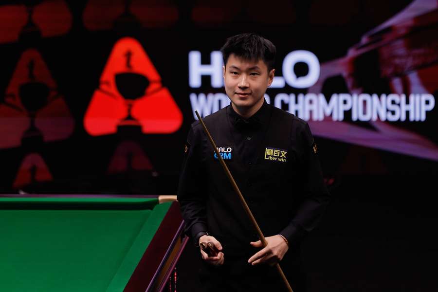 Zhao celebrates his progress to the next round
