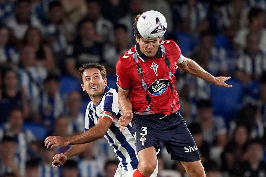 Mikel Oyarzabal of Real Sociedad goes up for a header with Marcos Alonso of Celta Vigo Mikel Oyarzabal of Real Sociedad goes up for a header with Marcos Alonso of Celta Vigo