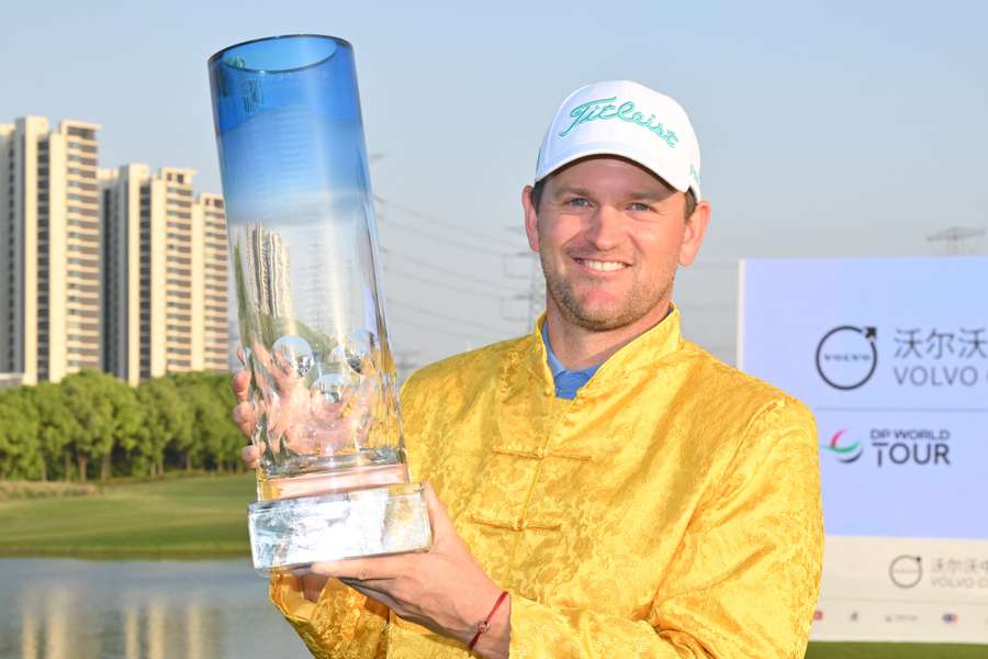 Austria's Bernd Wiesberger poses with the trophy after winning the China Open