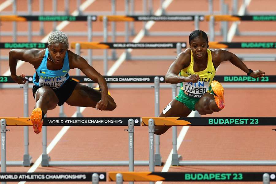 Bahamas' Devynne Charlton and Jamaica's Megan Tapper in action