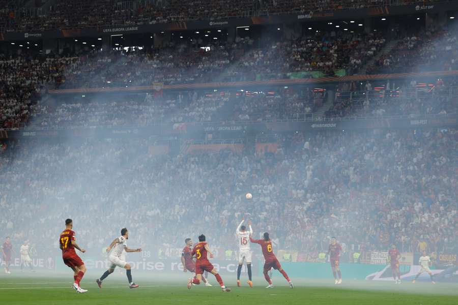 Smoke fills the stadium during the Europa League final