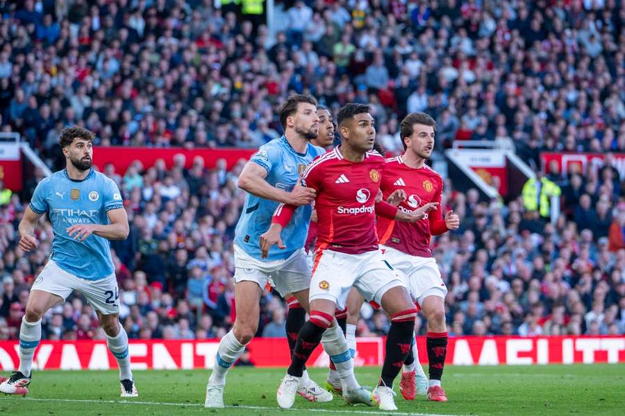 Man United's Casemiro and Man City's Ruben Dias during the Manchester derby in April 2025