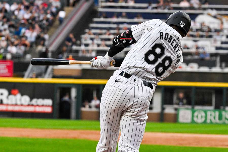 Chicago White Sox outfielder Luis Robert Jr. hits a home run against the Boston Red Sox during the first inning 