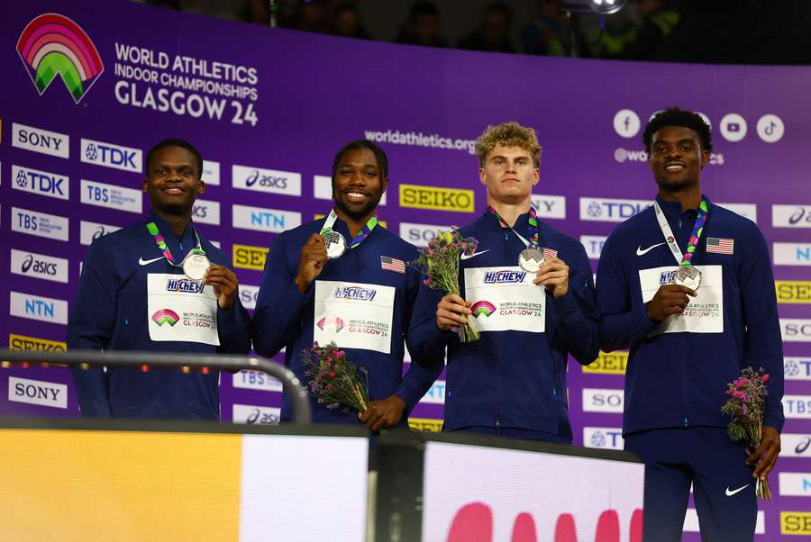 Silver medallists Noah Lyles, Jacory Patterson, Matthew Boling and Christopher Bailey of the USA celebrate on the podium after the men's 4x400m relay