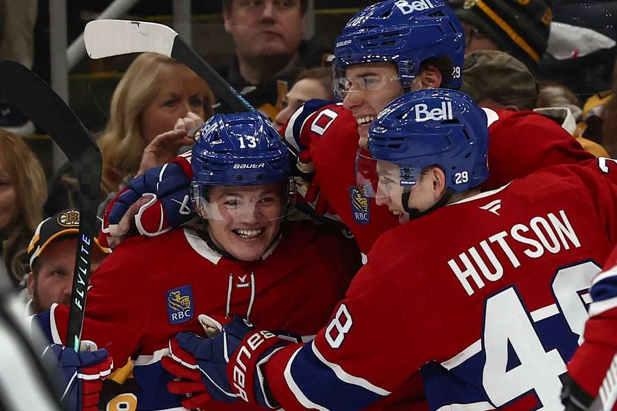 Cole Caufield (left) celebrates hat trick with Canadiens teammates Cole Caufield (left) celebrates hat trick with Canadiens teammates