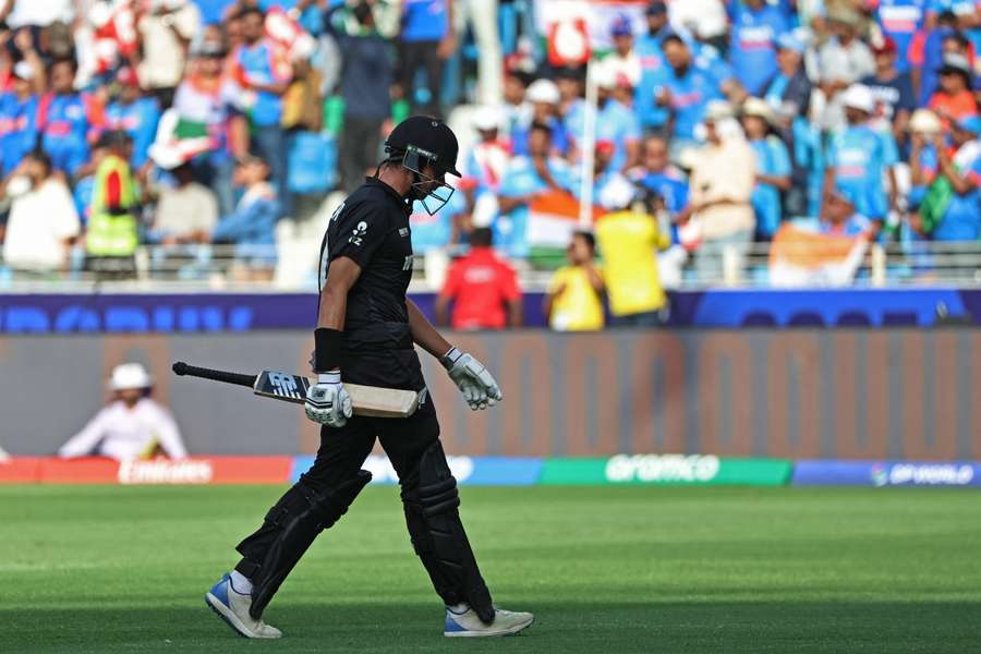 Santner walks back to the pavilion after his dismissal 