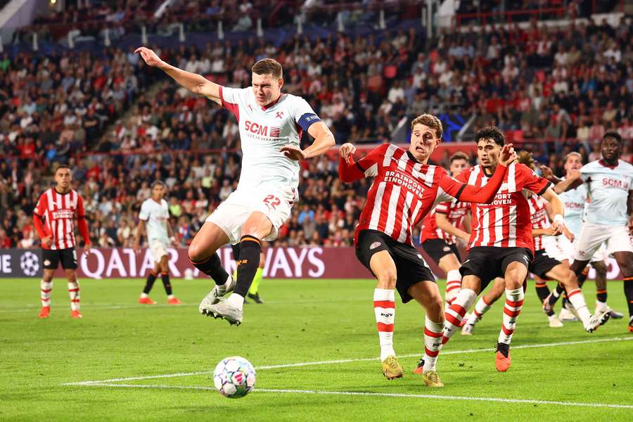 Shakhtar Donetsk's Mykola Matviyenko battles with PSV's Guus Til Shakhtar Donetsk's Mykola Matviyenko battles with PSV's Guus Til