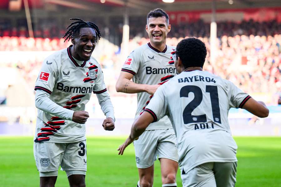 Bayer Leverkusen's Jeremie Frimpong (L) celebrates after his goal