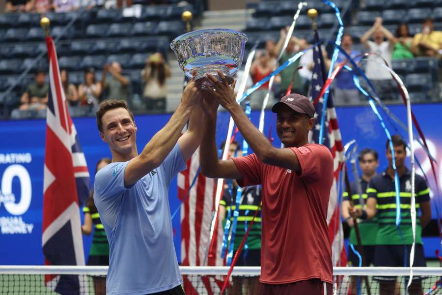 Rajeev Ram and Joe Salisbury lift the trophy after winning in three sets