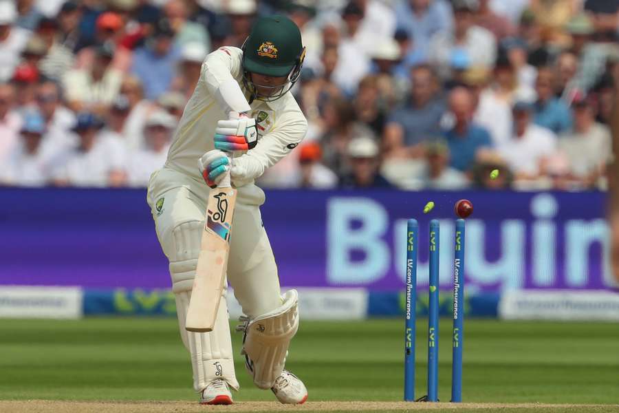 Australia's wicket keeper Alex Carey is bowled by England's James Anderson