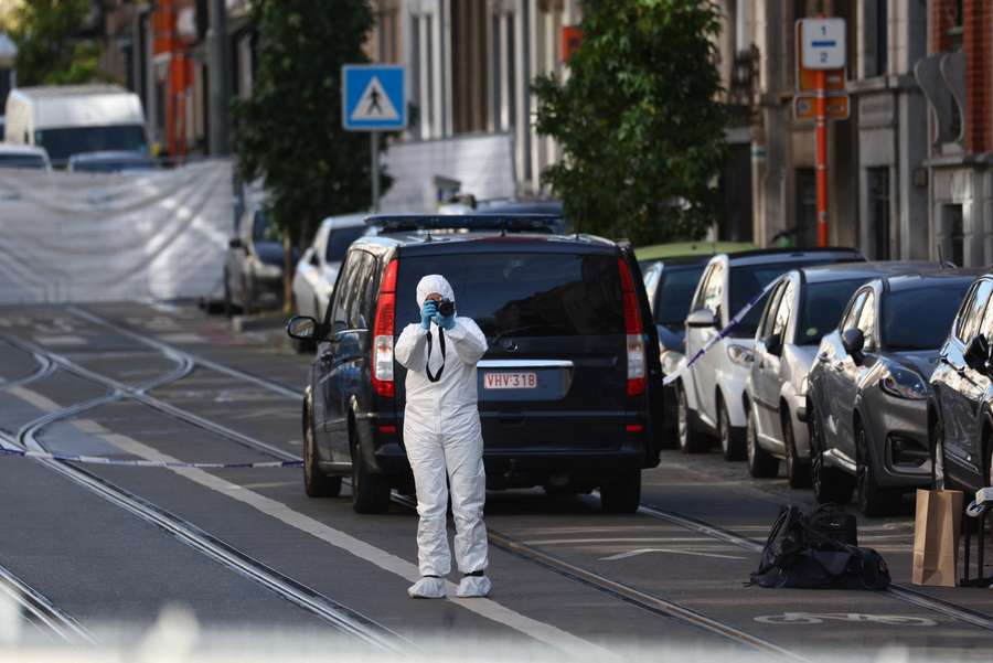 A forensic officer works after a police operation