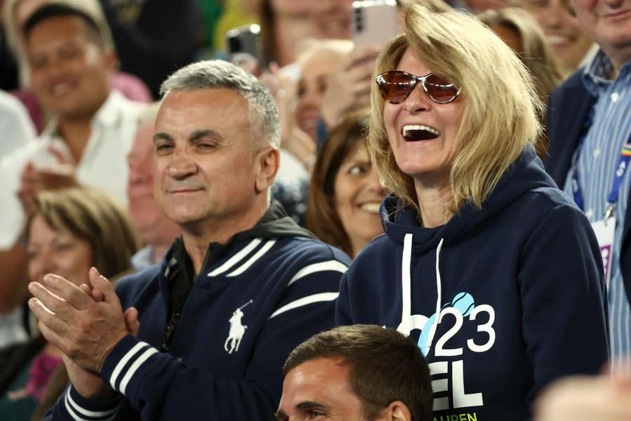 Srdjan Djokovic (L) and mother Dijana Djokovic (R), react after he beats Russia's Andrey Rublev in the men's singles quarter-final match